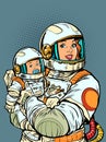 Joyful mother astronaut with a baby in her arms. Mothers Day. Pop art retro style. Cosmic woman in motherhood