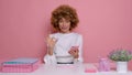 Joyful office woman employee, makes gesture ok, isolated next to pink background