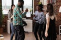 Joyful people dancing at friendship celebration event held at home Royalty Free Stock Photo