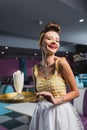 joyful pin up waitress with tattoo Royalty Free Stock Photo