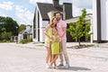 Joyful pleasant man hugging his wife and daughter Royalty Free Stock Photo