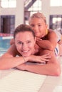 Joyful positive woman lying near the pool