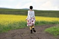 Joyful positive woman running on a countryside road Royalty Free Stock Photo