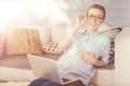 Joyful pregnant woman using laptop at home Royalty Free Stock Photo