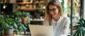 A Joyful Professional With Glasses Excels With Her State-Of-The-Art Laptop Royalty Free Stock Photo