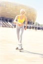 Joyful roller blader in front of Amber Stadium Royalty Free Stock Photo