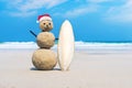 joyful Sandman of white sand on the clean beach of an exotic island on the background of blue sea and cloudy sky