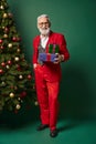 joyful Santa with glasses posing with