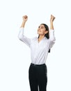 Joyful and satisfied woman in white shirt with raised hands showing her power, winner and achievement concept, isolated on white Royalty Free Stock Photo