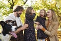 Joyful scene of family in autumn forest