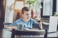 Joyful schoolboy studying with pleasure Royalty Free Stock Photo