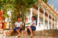 Joyful Schoolgirls Giggling Outside Temple on Tonle Sap Lake, Cambodia