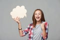 Joyful screaming teen girl holding thinking bubble Royalty Free Stock Photo