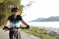 Joyful senior woman riding a bicycle