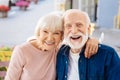 Joyful senior couple chortling