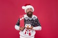 Joyful shopping. Favorite tradition. Happy new year. Christmas gift concept. Man celebrate winter holiday. Hipster in Royalty Free Stock Photo