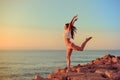 Joyful slim lady in bikini jumping standing on