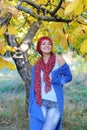 Joyful smiling woman outdoor portrait, dressed in knitted beret