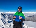 Joyful snowboarder in the mountains Royalty Free Stock Photo