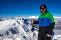 Joyful snowboarder in the mountains Royalty Free Stock Photo