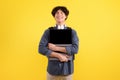 Joyful Student Guy Hugging Laptop Computer Posing Over Yellow Background Royalty Free Stock Photo