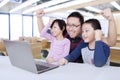 Joyful students and teacher raise hands in class Royalty Free Stock Photo