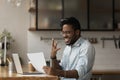 Joyful surprised young african american businessman holding paper with amazing news. Royalty Free Stock Photo