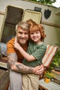 joyful tattooed man with adorable redhead