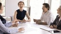 Joyful team members having conversation during seminar or morning briefing Royalty Free Stock Photo