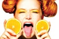 Joyful teen girl with juicy oranges. Freckles Royalty Free Stock Photo