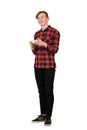 Joyful teenage boy playing video games isolated over white background. Excited guy stand all ears holding a joystick console