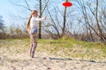 Joyful teenage girl, blonde is throwing flying disk