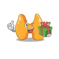 Joyful thyroid cartoon character with a big gift box