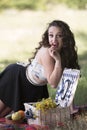 Young beautiful woman having a picnic Royalty Free Stock Photo