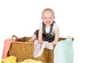 Joyful toddler in wicker basket