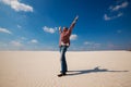 Joyful tourist, man is enjoying traveling in the desert