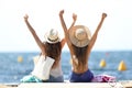 Joyful tourists on summer vacations on the beach Royalty Free Stock Photo