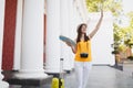 Joyful traveler tourist woman with suitcase, city map, retro vintage photo camera waving hand for greeting, meeting Royalty Free Stock Photo