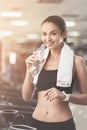 Joyful woman drinking water after sport exercises Royalty Free Stock Photo