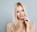 Joyful woman face close-up. Blonde model with fresh clear skin and healthy silky hair on white background Royalty Free Stock Photo