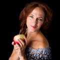 Joyful woman holding fresh apple Royalty Free Stock Photo