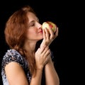 Joyful woman holding fresh apple Royalty Free Stock Photo