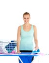 Joyful woman ironing her clothes Royalty Free Stock Photo