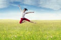 Joyful woman leaps at field in springtime Royalty Free Stock Photo