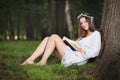 Joyful woman reading outdoor Royalty Free Stock Photo