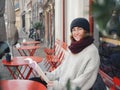 Joyful Woman Reading Session on a Cool Urban Morning Street Side Cafe Royalty Free Stock Photo