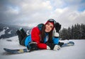 Joyful woman snowboarder in winter at ski resort Royalty Free Stock Photo