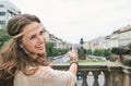 Joyful woman tourist pointing on Saint Wenceslas statue, Prague Royalty Free Stock Photo