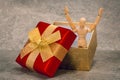 Joyful, wooden mannequin jump out of the gift box Royalty Free Stock Photo