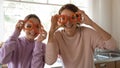 Joyful young adolescent daughter having fun with mom. Royalty Free Stock Photo